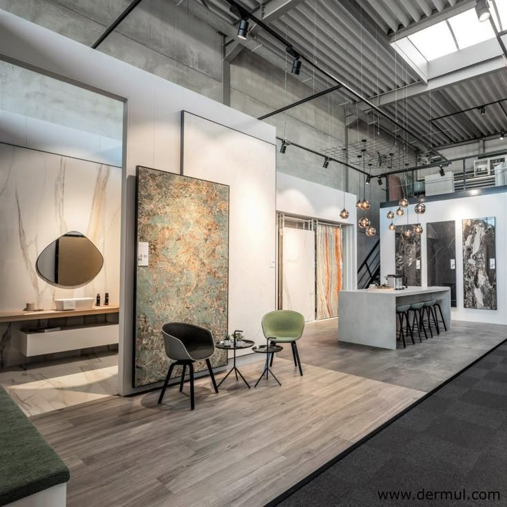 the interior of an art gallery with chairs and tables