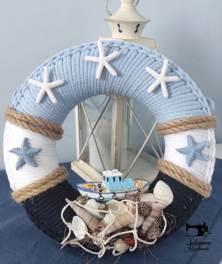 a blue and white wreath with starfishs on it