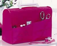 a pink suitcase sitting on top of a white table