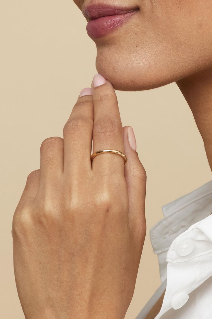 Our Everything Stack Ring is as versatile as it is shiny. The gentle curve of this comfort fit band gives it a slight dome effect while remaining gorgeously classic. This is a must-have for any curated jewelry collection as you can wear it on any finger solo or in a stack. P.S. this also makes a great wedding band! Metal: 14 Karat Yellow Gold Dimensions: 2mm Band Width Weight: 0.7 Grams Available in Multiple Sizes Origin: Crafted in Bologna, Italy Elegant Yellow Gold Stackable Rings With Thick Band, Elegant Adjustable Rings With Polished Finish, Elegant Stackable Thick Bands, Elegant 14k Gold Stackable Rings With Thick Band, Elegant Stackable Wedding Rings With Thick Band, Modern Anniversary Bands, Elegant Dome Ring With Open Band For Anniversary, 14k Gold Rings With Smooth Thick Band, Classic Everyday Round Band Jewelry