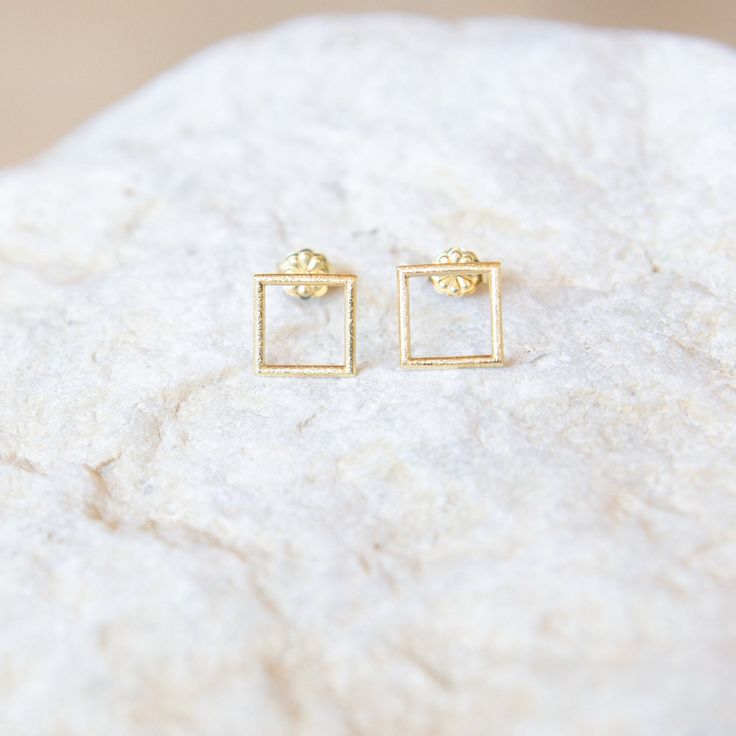 "✦Handmade Solid Gold Square Earrings. ✦With its geometric simple shape,its a minimalist  accessory to complement any look,for every day. Gold Square Earrings,Geometric Earrings,9K,14K,Solid Gold Studs,Minimalist Jewelry,Gift For Her,Mother's Day Gift,Everyday Earrings,IUnique Holiday Gift DIMENSIONS ✦Dimensions are 0.41\"(approx. 10.65mm) x 0.41\"(approx.10.65mm) and 0.047\" thick(approx1.21mm) ✦Earrings have a matte textured finish. ✦Earring push backs are included and they are also solid gold Minimalist Earrings In Recycled Gold, Modern Recycled Gold Earrings As Gift, Modern Recycled Gold Earrings For Gift, Minimalist 14k Gold Rectangular Earrings, Rectangular Yellow Gold Earrings For Gifts, Gold Square Earrings For Anniversary, Hypoallergenic Recycled Gold Earrings For Gifts, Hammered 14k Gold Earrings For Gift, Minimalist Yellow Gold Earrings For Gift