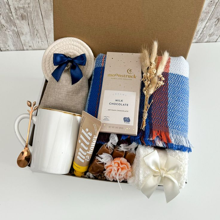 a gift box containing coffee, tea, and other items for someone's special occasion