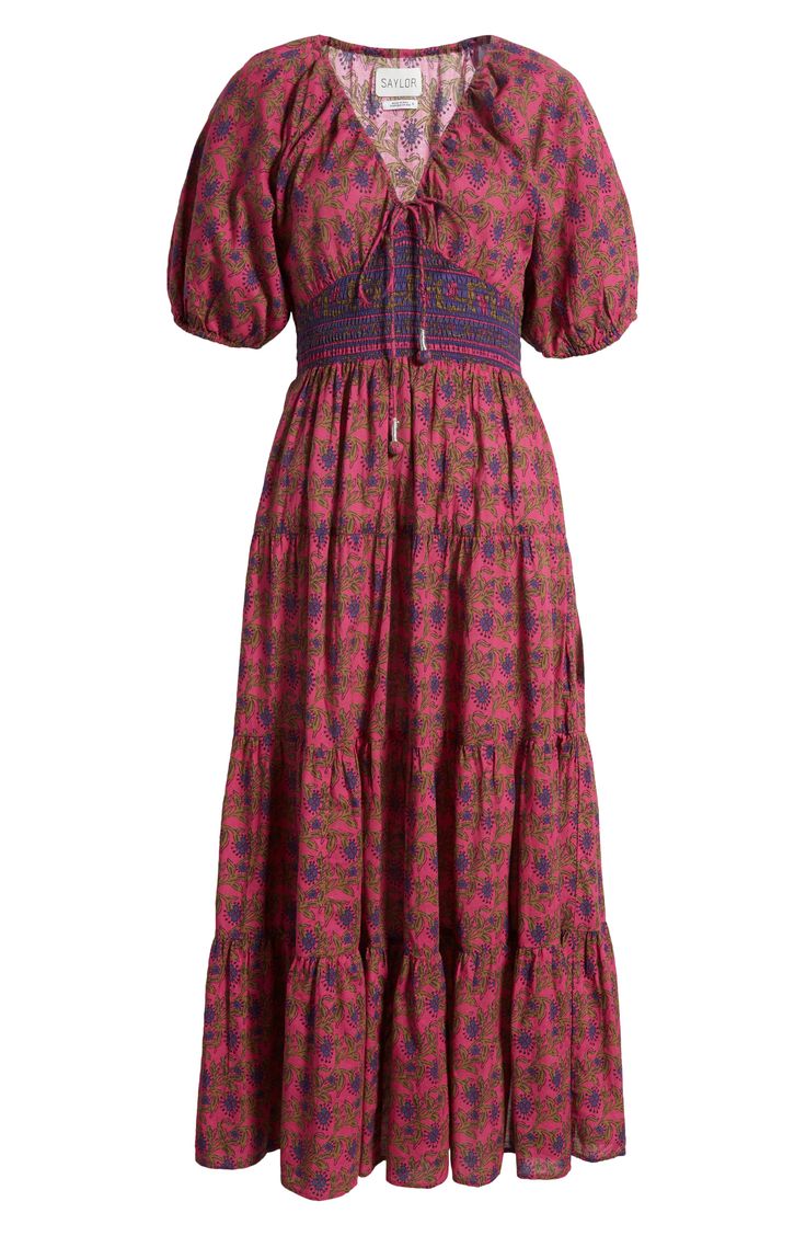 Bring a boho beat to your days and nights in a maxi made with rows of ruffles and splashed with a vibrant print. 40 1/2" center front length (size Medium) V-neck Short sleeves with elastic cuffs Elastic waist 100% cotton Dry clean Imported Bohemian Tiered Maxi Dress With Smocked Bodice, Spring Bohemian Maxi Dress With Ikat Print, Bohemian Multicolor Maxi Dress With Smocked Bodice, Bohemian Tiered Maxi Dress, Bohemian Tiered Dress With Boho Print, Bohemian Fitted Tiered Midi Dress, Bohemian Midi Dress With Vibrant Print, Cotton Maxi Dress, Cotton Maxi