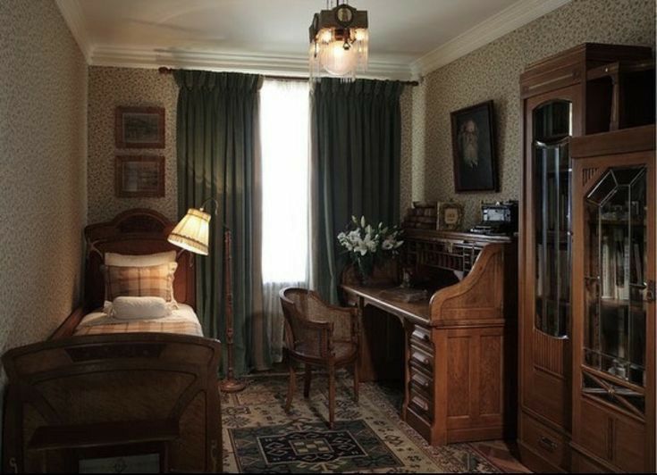 an old fashioned bedroom with antique furniture and green curtains