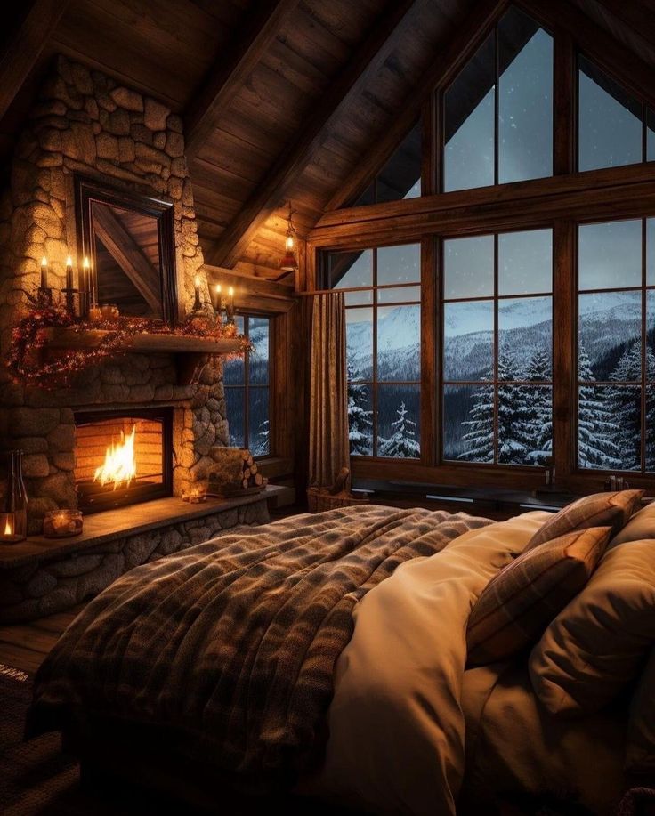 a bedroom with a fireplace and large windows