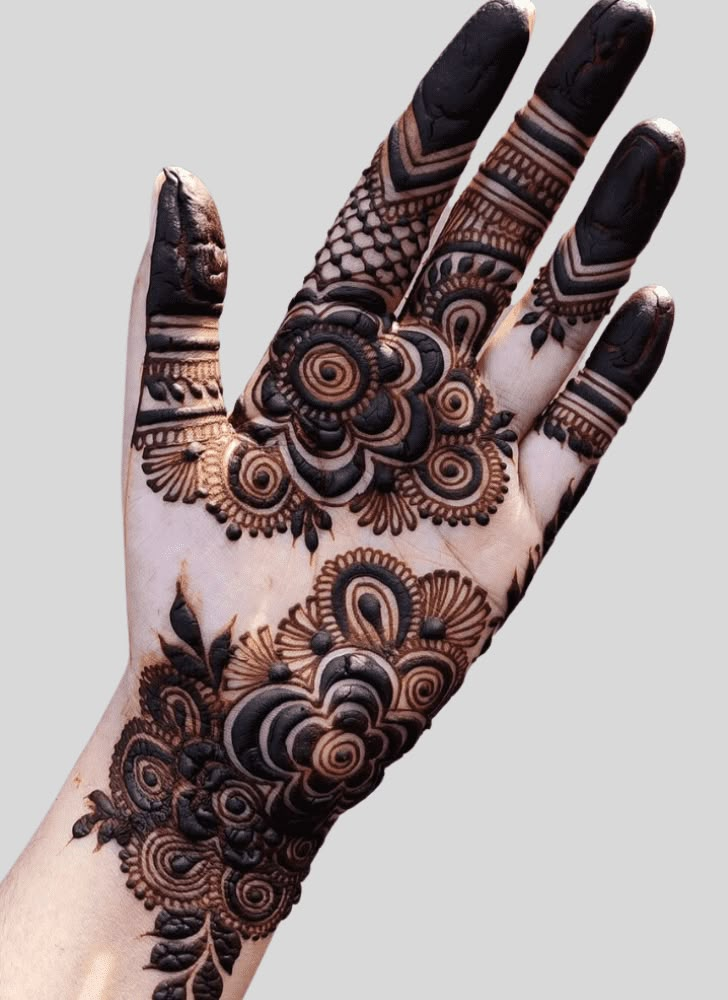 a hand with henna tattoos on it