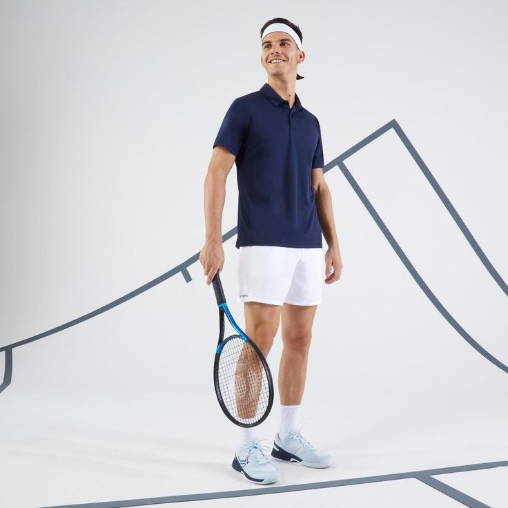 a man holding a tennis racquet in front of a white background