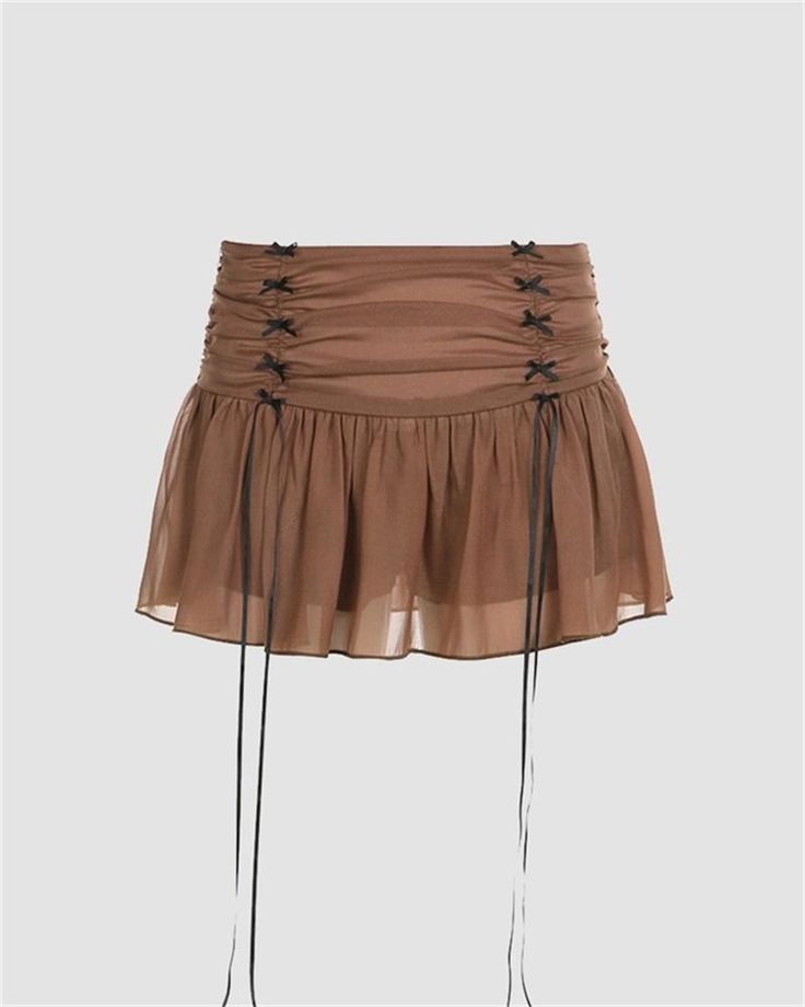 Details: Short skirt with strings designSkirt Length: ShortMaterials:95% Polyester + 5% Spandex Chic Drawstring Mini Skirt For Summer, Chic Summer Mini Skirt With Drawstring, Mini Skort With Drawstring For Spring, Spring Drawstring Mini Skort, Spring Mini Skort With Drawstring, Spring Skirt With Tie-side Bottom, Casual Nylon Mini Skirt, Spring Flowy Tie-side Skirt, Summer Mini Skort With Drawstring