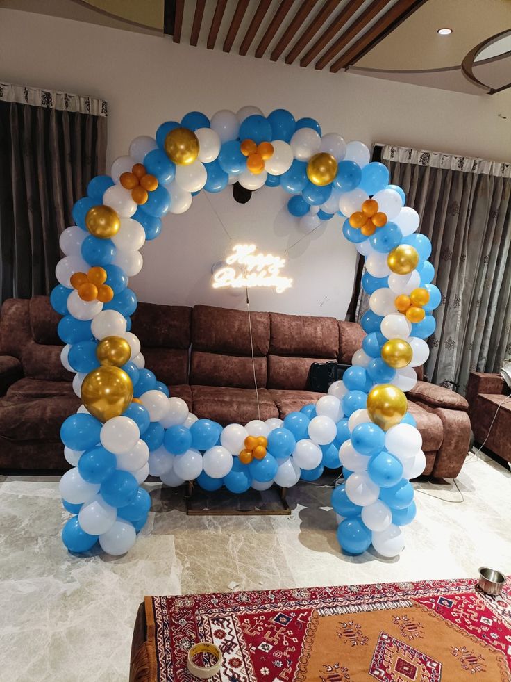 a balloon arch in the middle of a living room