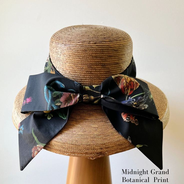 Our signature Middy Bow hat band is a removable hatband and bow combination that fits all of our ladies hat styles. The bow hatband is easily removable via a hidden closure and can be switched out for a different band in a matter of seconds, allowing you to mix and match hat shapes and bands to curate your own signature sun hat collection. Hidden Velcro dots hold the band securely in place on the hat. This listing is for one Middy Bow Hatband only. Hats shown below are the Meadow Hat, Tailored M