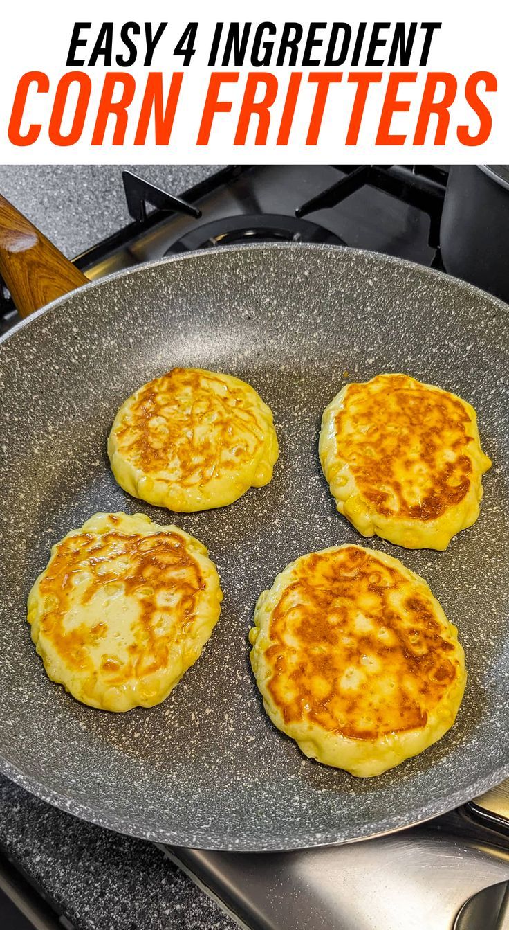 four fried corn fritters in a frying pan on the stove with text overlay reading easy 4 ingredient corn fritters