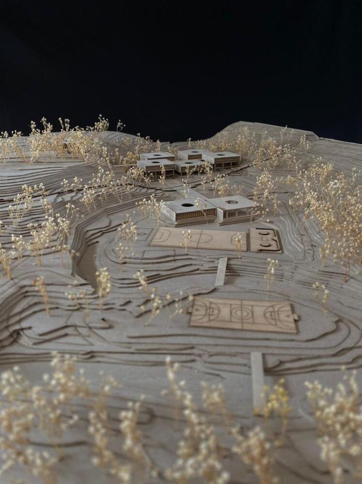 a model of a desert with buildings and trees