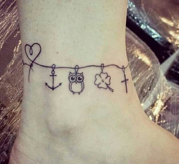 a small tattoo on the foot of a person with an anchor and heart shaped balloons