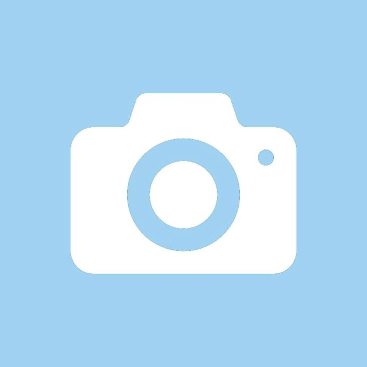 a white camera on a blue background