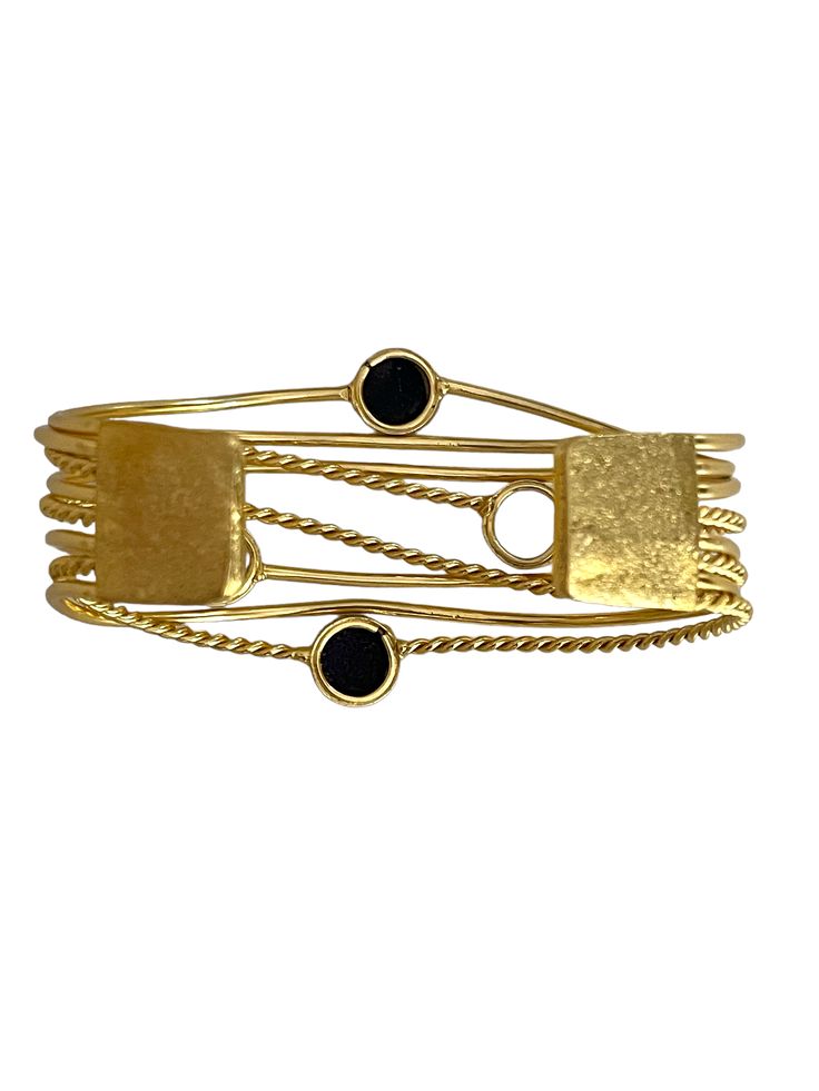 Stylish and refined, Bal golden wrist cuff which translates for Power, is perfect for occasion wear and every day luxury. Dipped in gold, the design features a delicate design studded with Black Obsidian. Two rows of ivory Pearls around the circumference conclude the design. This bangle is a treat to watch and own! Gold Fusion Style Cuff Bracelet As Gift, Luxury Brass Bangle, Adjustable Gold Fusion Cuff Bracelet, Adjustable Gold Fusion Style Cuff Bracelet, Adjustable Gold Cuff Bracelet In Fusion Style, Gold Fusion Bangle Bracelets, Gold Fusion Style Bangle Bracelets, Adjustable Yellow Gold Bracelets For Evening, Fusion Style Gold Bangle Bracelets