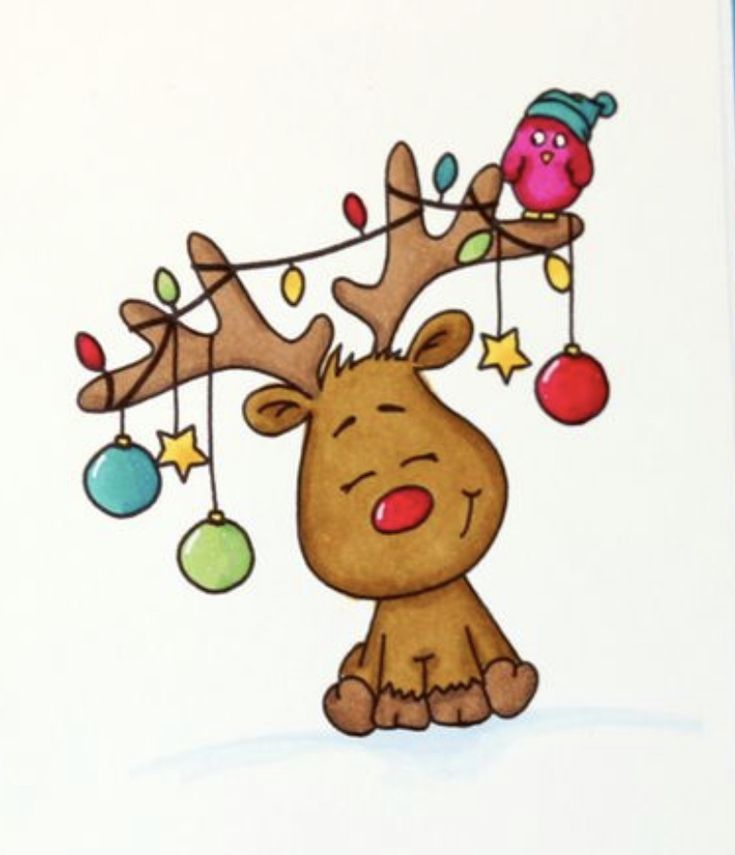 a christmas card with an image of a reindeer hanging from a string and ornaments on it