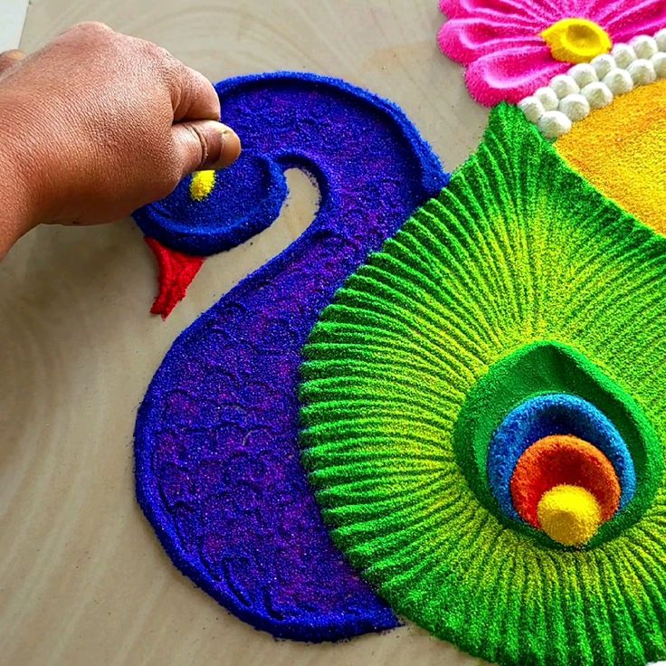 a person is making an art project out of yarn