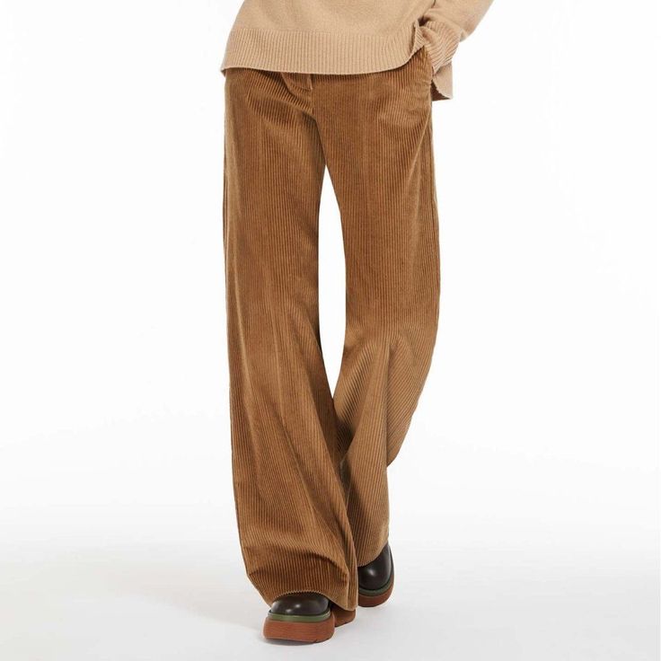 Embrace Timeless Style with Every Step Discover the perfect blend of comfort and sophistication with our High-Waist Wide-Leg Corduroy Trousers, a must-have for the autumn and winter seasons. Specially designed for the modern woman, these trousers offer a seamless combination of elegance and practicality. Whether you're heading to the office, enjoying a casual day out, or dressing up for an evening event, these trousers are your go-to choice for every occasion. Exceptional Features for Unmatched Fitted Corduroy Pants For Winter, Winter Fitted Corduroy Pants, Corduroy Bottoms For Winter Workwear, Elegant Corduroy Bottoms For Work, Elegant Corduroy Bottoms For Fall, Winter Corduroy Full Length Bottoms, Chic Cotton Winter Pants, Winter Full-length Corduroy Bottoms, Chic Winter Cotton Pants