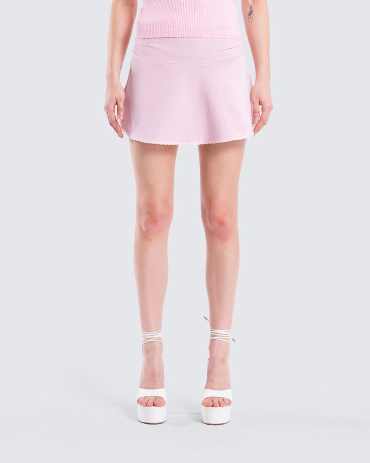 Embrace your flirty side in this pink mini skirt 💕 Made from stretch jersey and complete with a foldover waistband, a picot lace trim on the hem, and an invisible side seam zipper, this mini is the perfect sweet and sassy staple 😌 Pink Stretch Elastane Skirt, Spring Fitted Ruffled Swim Skirt, Chic Pink Skirt With Lace Trim, Spring Ruffled Fitted Swim Skirt, Spring Fitted Swim Skirt With Ruffles, Fitted Ruffled Swim Skirt For Spring, Flirty Fitted Short Length Tennis Skirt, Flirty Stretch Swim Skirt For Spring, Flirty Fitted Mini Tennis Skirt