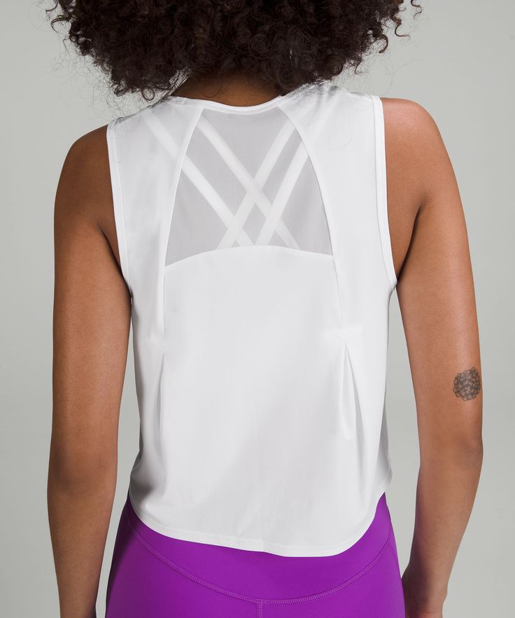 Sprints anyone This lightweight cropped tank has mesh fabric panels for breathability in sweaty situations. Designed for Running. An easy fit that floats away from your body:Cut above the waist-perfect with high-rise pants. Reflective details . High Rise Pants, Fabric Panels, Sleeveless Tank Top, Sleeveless Tank, Cropped Tank Top, Crop Tank, Mesh Fabric, Womens Tank, Tank Tops Women