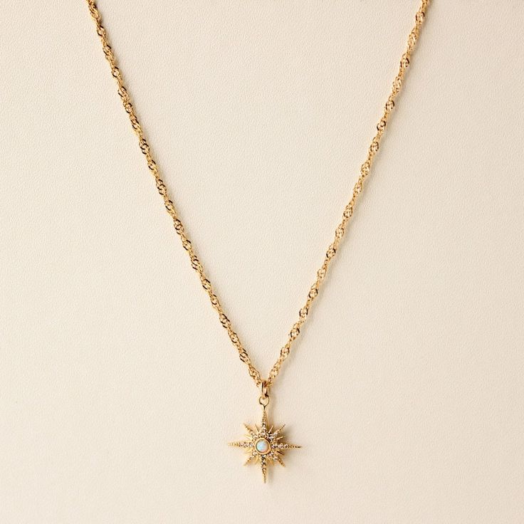 D E T A I L S • Single Chain (of choice) with charm• 18k Gold Filled• Singapore Chain: 16" + 1" extender• Cable Chain: 17" + 1" extender• Opal Starburst Charm: ~14.5mm M A T E R I A L S •Our Gold filled jewelry has an outer layer of 14k or 18k gold that is pressure bonded to a base metal of jewelers brass. •This type of jewelry is made for everyday use of stacking or layering. • This type of jewelry can withstand normal body sweat, body oils, and is typically water resistant. J E W E L R Y C A R Body Sweat, Starburst Necklace, Normal Body, Body Oils, Celestial Jewelry, Gold Necklace Women, Diamond Star, Chain Gold, Cz Diamond