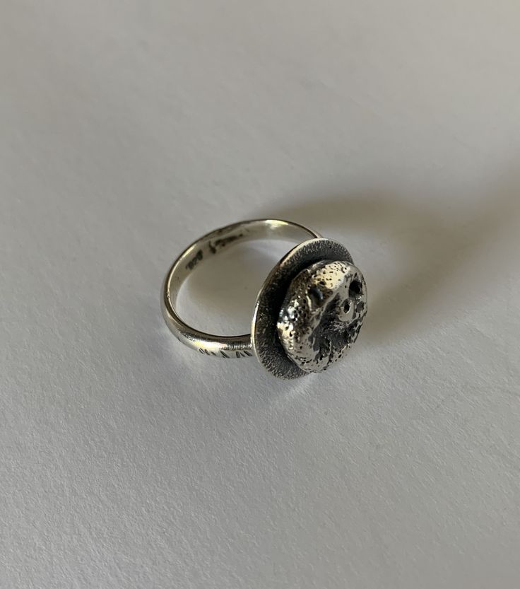 This ring has been oxidized to show that beautiful contrast with sterling silver. The size is 7 1/2 Can be worn on any finger. Very comfortable wear Handcrafted by Bella Brutalist Oxidized Open Ring, Unique Oxidized Open Engraved Ring, Sterling Silver Rings With Oxidized Finish, Brutalist Sterling Silver Rings With Oxidized Finish, Open Ring With Oxidized Finish, Hand Cast Sterling Silver Engraved Ring, Minimalist Sterling Silver Ring With Oxidized Finish, Hand-cast Engraved Sterling Silver Ring, Hand Cast Engraved Sterling Silver Ring