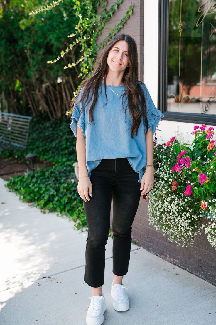 The Emily Denim Top is a casual, light blue denim top that offers a relaxed, laid-back vibe perfect for everyday wear. The fabric is soft and lightweight, making it comfortable and breathable for any season. The top features a simple round neckline and a single chest pocket, adding a touch of classic style. The slightly oversized fit and curved hemline enhance its relaxed look, making it easy to pair with jeans, shorts, or leggings. The Fabric: 100% Tencil Product details: Casual, relaxed fit. F Relaxed Fit Light Wash Denim Top For Day Out, Casual Relaxed Fit Denim Top Made Of Tencel, Light Wash Chambray Denim Top, Light Wash Chambray Denim Top For Day Out, Light Wash Relaxed Fit Denim Top, Washed Chambray Denim Top For Day Out, Medium Wash Denim Tops For Day Out, Relaxed Fit Light Wash Chambray Denim Top, Denim Blue Top With Frayed Hem For Day Out