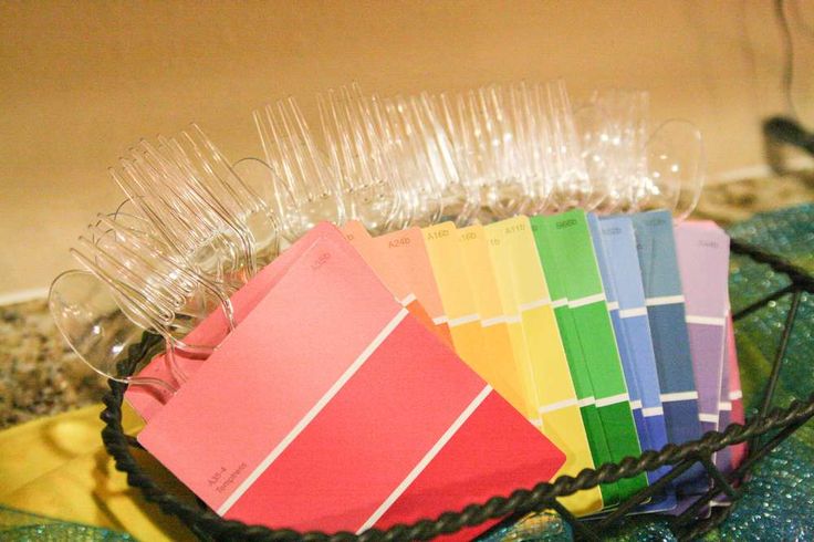 a basket filled with lots of different colored papers