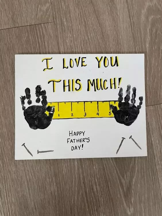 a father's day card that says i love you this much with handprints on it