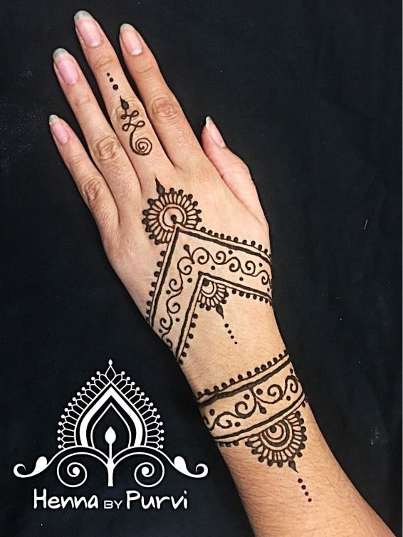 henna tattoo on the palm of a woman's hand