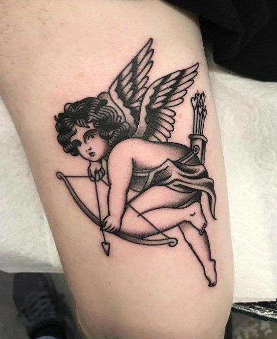 an angel tattoo on the leg of a woman with bow and arrow in her hand