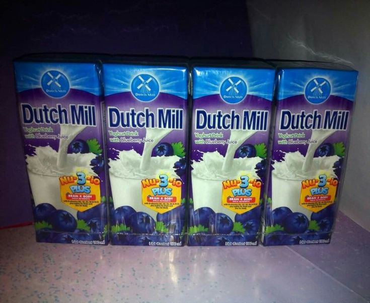 three boxes of dutch mill milk sitting on a counter