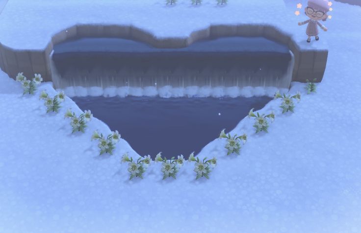 an animated image of a heart shaped pond in the snow, with a person standing next to it