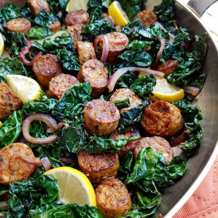 a pan filled with meat and vegetables on top of a table