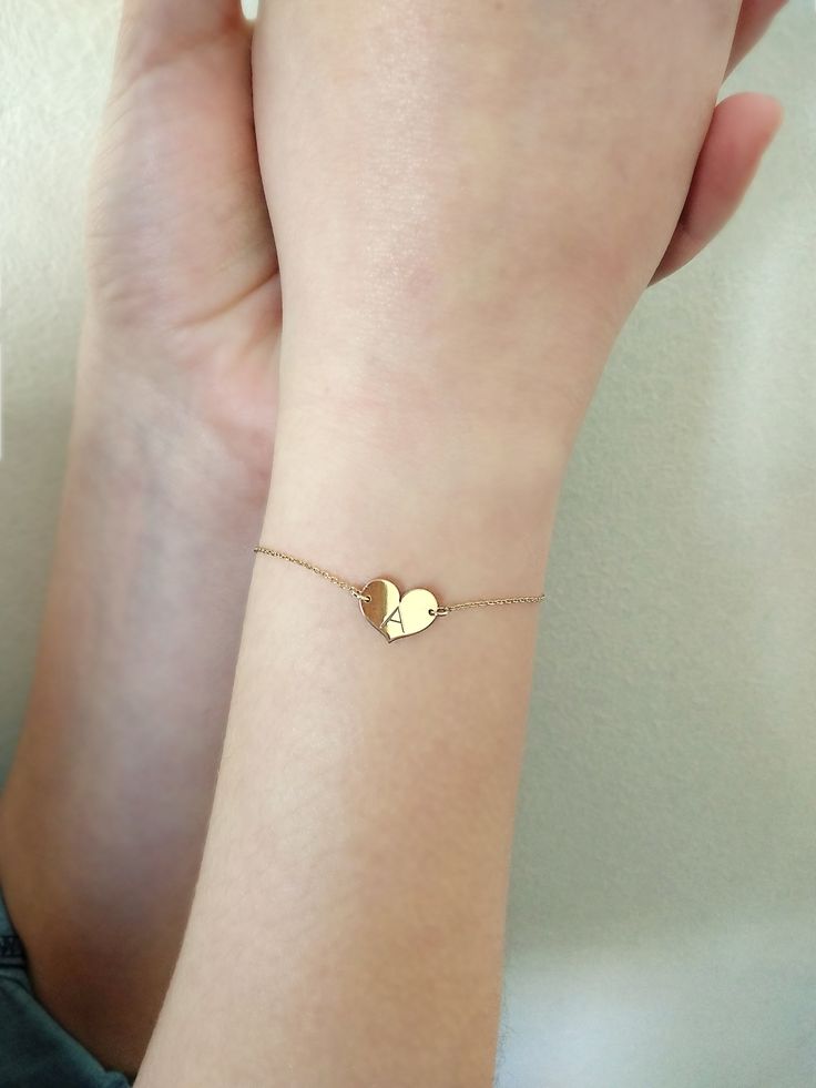 "14K 9K Small heart charm bracelet with Engraved Initial, Solid gold bracelet, Custom Monogram gold bracelet, Personalized gold bracelet, Valentine's Gift, Gift for her, 14K Rose Gold bracelet, Bridesmaid gift, Bridal jewelry, Dainty gold bracelet, FREE EXPRESS SHIPPING Delicate minimalist 14K solid gold bracelet with a small heart charm engraved with one or two initials. A wonderful and thoughtful gift for you and your loved ones! Infinity bracelet: https://www.etsy.com/listing/608986075 Boho e Gold Charm Bracelet With Heart Charm As Gift, Gold Name Bracelet With Heart Charm For Anniversary, Heart Charm Bracelet For Anniversary, Yellow Gold Heart Bracelet For Anniversary On Mother's Day, Heart-shaped Bracelets For Best Friend Valentine's Day Gift, Heart Bracelet For Best Friend And Mother's Day, Heart Bracelet For Mother's Day And Best Friend Gift, Best Friend Gift Heart Bracelets For Valentine's Day, Valentine's Day Heart Charm Bracelet For Best Friend