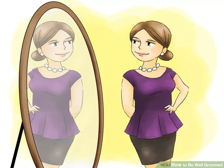 a woman standing in front of a mirror with her hands on her hips looking at herself