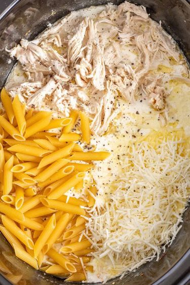 pasta, chicken and parmesan cheese are in the crock pot