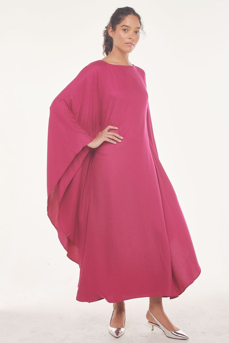 There is a reason why cultures around the globe have been wearing this silhouette for thousands of years—it’s the only piece you need (wear it as a beach cover-up, as loungewear, or pair it with flats or strappy heels for a night out). This Viscose Crepe Maxi Kaftan is made from plant-based viscose and recycled bananas. Sounds bananas —but it’s true!Fabric • Made in India in a Fair Trade Sustainability Alliance-certified facility • 100% FSC-certified viscose moss (a plant-based fabric) • 0 harmful chemicals or dyes used in the making of this garment • Eco-friendly and biodegradable Sizing and Measurements size xs s m l xl Centre back length: 127 128 129 130 131 shoulder edge to edge: 141 144 147 150 153 chest 1/2: 51 54 57 60 63 neck width: 25.5 18 18.5 19 19.5 front neck drop: 4.2 4.5 4.9 Elegant Beach Abaya For Spring, Elegant Spring Beach Abaya, Elegant Abaya For Summer Vacation, Elegant Summer Abaya For Vacation, Elegant Summer Vacation Abaya, Summer Vacation Abaya With Kimono Sleeves, Long Sleeve Abaya For Summer Vacation, Elegant Maxi Beach Tunic, Elegant Oversized Tunic For Beach