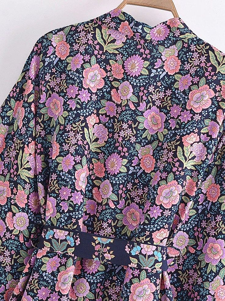 This kimono has a billowy, longline silhouette with a blended bohemian-inspired floral print and a front tie clasp, making it a gorgeous beach staple. Specs: Bohemian style Maxi length Kimono sleeves Material: Cotton, rayon Spring Floral Embroidered Kimono With Kimono Sleeves, Spring Floral Embroidery Kimono With Kimono Sleeves, Floral Print V-neck Kimono For Brunch, V-neck Floral Print Kimono For Brunch, Spring Vacation Kimono With Floral Embroidery, Summer Floral Embroidered Kimono With Kimono Sleeves, Casual Summer Kimono With Floral Embroidery, Summer Kimono With Floral Embroidery And Kimono Sleeves, Summer Kimono With Floral Embroidery