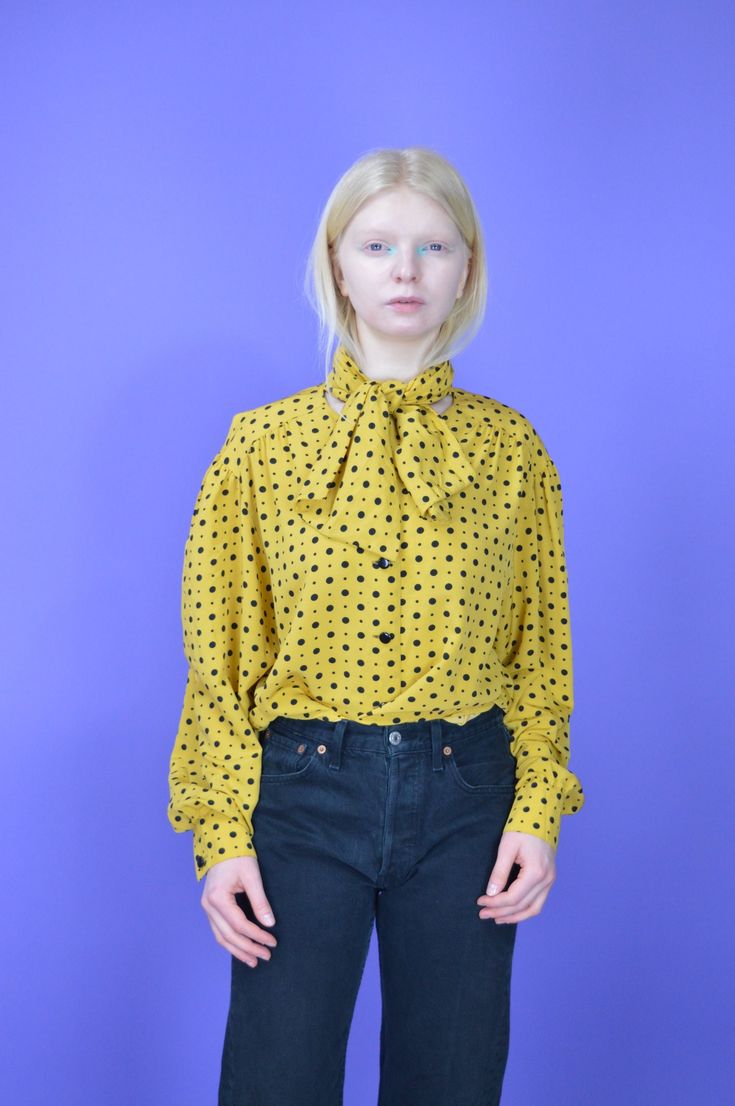 Vintage yellow classic 80's long sleeve blouse {W339} PRODUCT INFO: Material - 100% POLYESTER / Size tag on item - XL / FULL LENGTH - 77 CM / 30 INCH / PIT TO PIT - 59 CM / 23 INCH / Our model is 170 CM and normally wears a size S INFO: Due to item's vintage condition, the original tag might not show the true size. If you have any questions about this product or shipping just drop us a message and we will get back to you as soon as possible. CONDITION: Please note that Hanger Vintage sell true v Yellow Fitted Shirt For Fall, Fitted Yellow Shirt For Fall, Vintage Long Sleeve Tops For Workwear, Casual Long Sleeve Tops For Vintage Fashion, Casual Long Sleeve Vintage Fashion Tops, Vintage Fashion Long Sleeve Summer Blouse, Summer Vintage Fashion Long Sleeve Blouse, Vintage Long Sleeve Tops For Spring, Long Sleeve Vintage Tops For Vintage Fashion