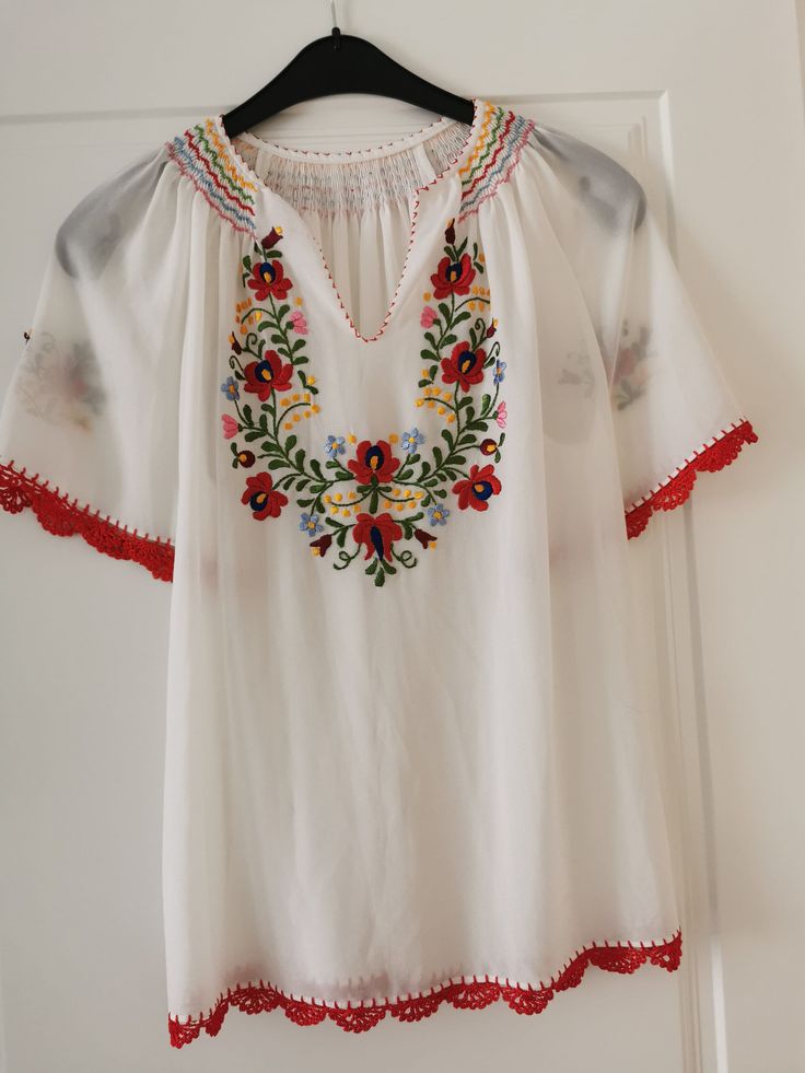 Semi transparent, hand-embroidered Hungarian folk Matyo Kalocsa, armpit to armpit 55 cm, shoulder to hem 66 cm, crocheted piping. Can be washed at 30 degrees, no dryer. Boho vibe, bohemian, bohochic, folk, Careful shipping Summer Folk Blouse With Intricate Embroidery, Summer Peasant Blouse With Embroidered Neckline, Folk Style Summer Blouse With Embroidered Border, Folk Style Embroidered Top For Summer, Summer Folk Style Embroidered Top With Intricate Details, Summer Folk Style Embroidered Top With Intricate Embroidery, Summer Folk Blouse With Embroidered Border, Traditional Summer Peasant Top With Intricate Embroidery, Intricate Embroidered Folk Top For Summer