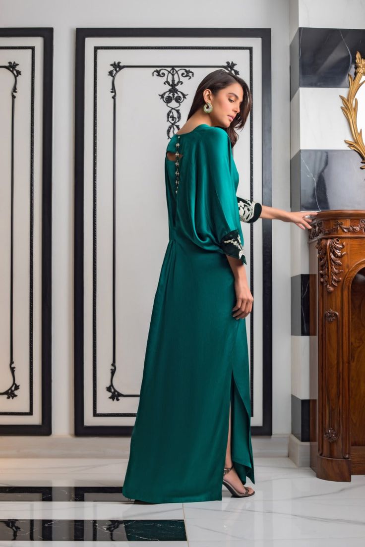 Teal Charmeuse Kaftan – Sania Maskatiya International Green Wedding Dress With Embroidered Sleeves, Green Embellished Silk Kaftan, Elegant Green Gown With Floral Embroidery, Festive Green Dress With Embroidered Neckline, Eid Evening Dresses With Draped Sleeves, Dress With Draped Sleeves For Party And Eid, Eid Party Dresses With Draped Sleeves, Party Dresses With Draped Sleeves For Eid, Evening Kaftan With Floral Embroidery For Eid