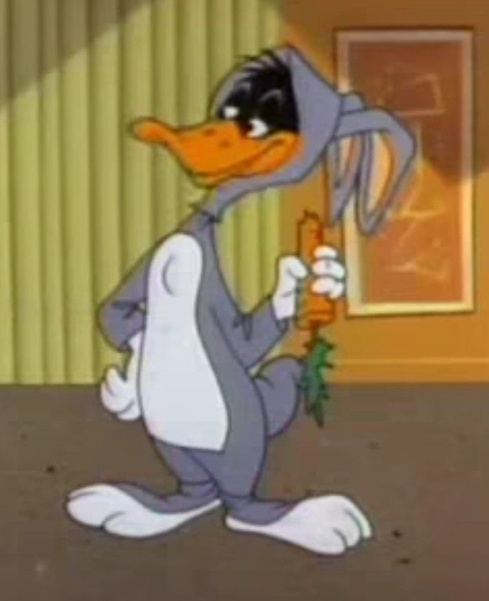 a cartoon duck holding a carrot in its hand