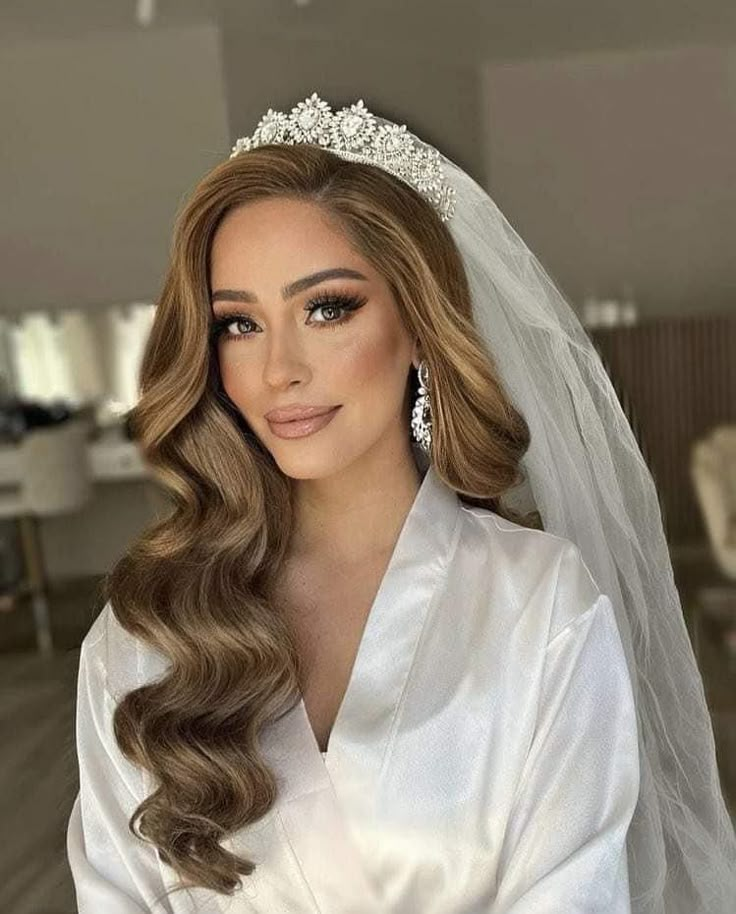 a woman with long hair wearing a wedding veil