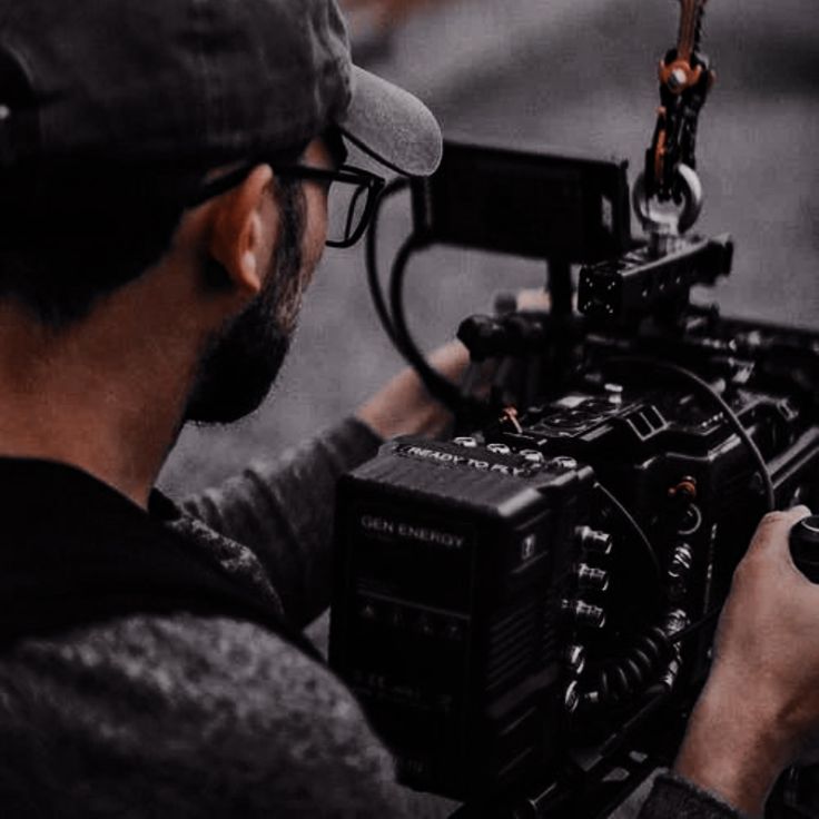 a man holding a camera in his hands