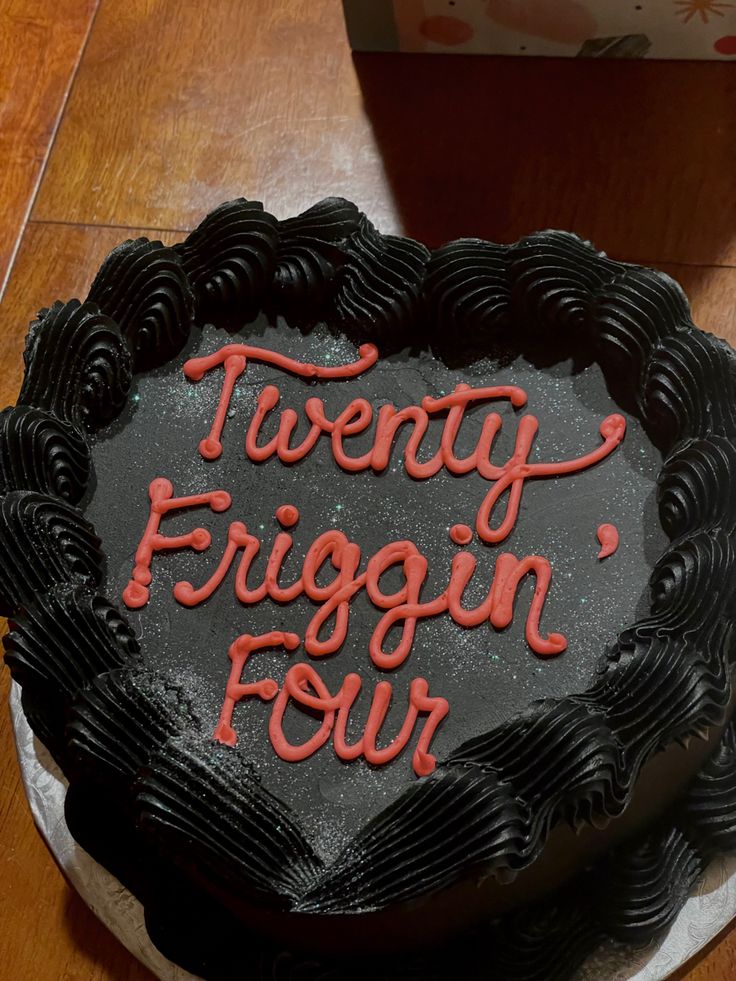 a heart shaped cake with the words twenty frigin'four written on it