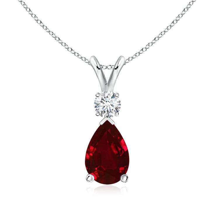 This classic solitaire pendant features a pear-shaped ruby secured in a prong setting. A brilliant round diamond sits atop the purplish red gemstone. Simple yet alluring, this ruby pendant in 14k white gold is crafted with a lustrous v-bale. Necklaces Collection, Necklaces Simple, Jewelry Cabinet, Solitaire Pendant Necklace, Jewelry Appraisal, Ruby Pendant, Red Gemstones, Ruby Jewelry, Teardrop Pendant