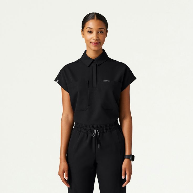 Acta Oversize Scrub Top in Black is a contemporary addition to women's medical outfits. Shop Jaanuu for scrubs, lab coats and other medical apparel. Flexibility And Mobility, Medical Scrubs, Scrub Sets, Chic Top, Tonga, Scrub Pants, Mongolia, Scrub Tops, Sierra Leone