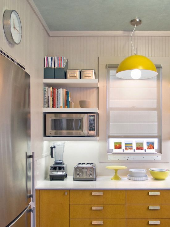 the kitchen is clean and ready to be used as a appliance for cooking