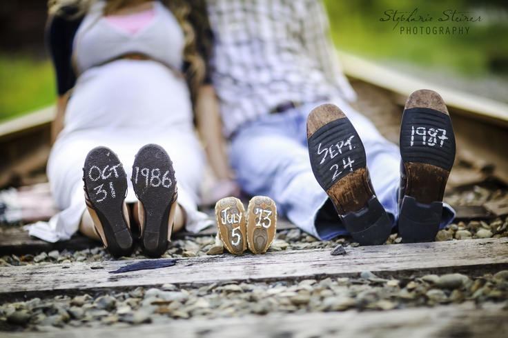 three pairs of shoes sitting on the ground next to each other with date written on them